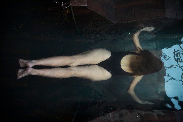 Spa concept with woman relaxing in water