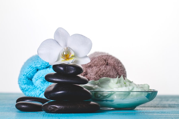 Spa decoration with volcanic stones and creme