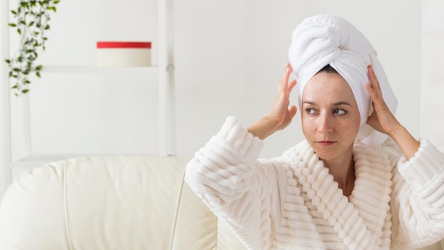 Spa at home woman in bathrobe looking away