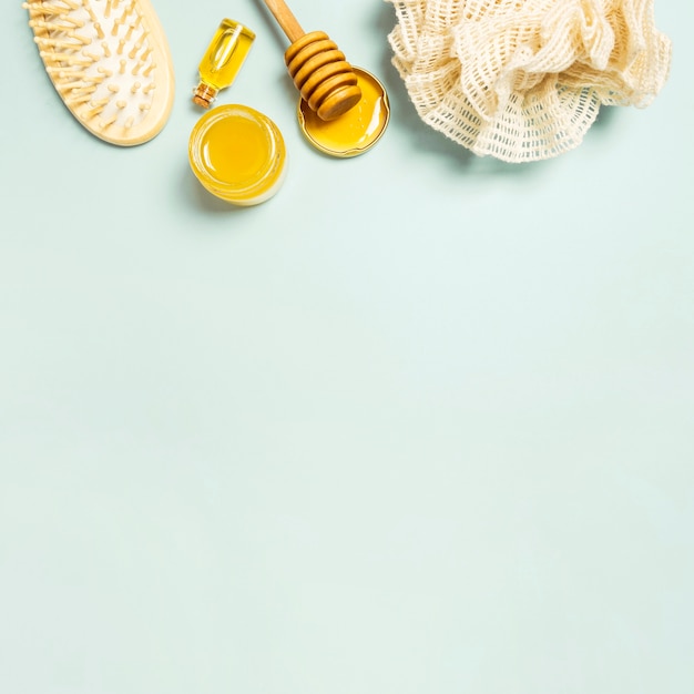 Spa ingredient and spa equipment on plain background
