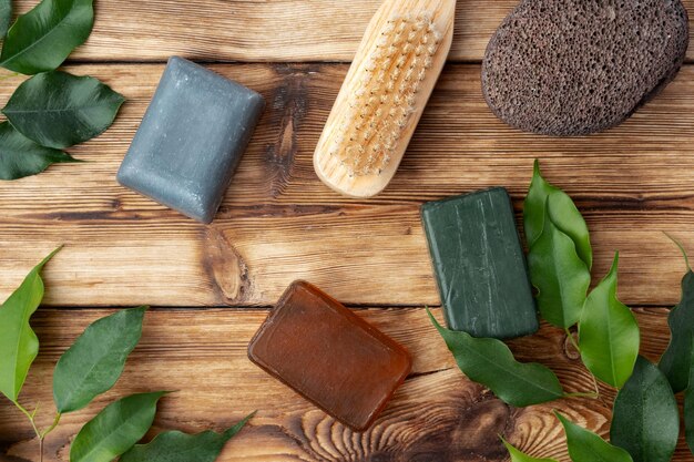 Spa photo with soap on rustic wooden background