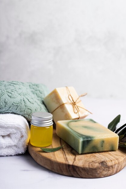 Spa set of scented soap with towels beside