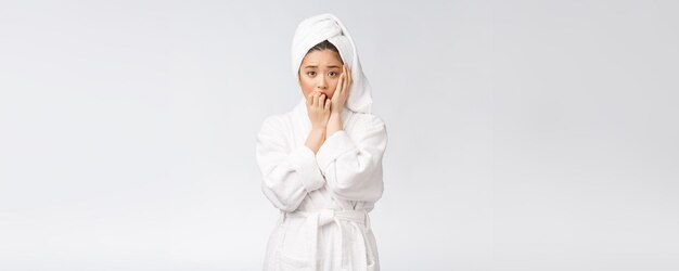 Spa skincare beauty Asian woman drying hair with towel on head after shower treatment Beautiful multiracial young girl touching soft skin