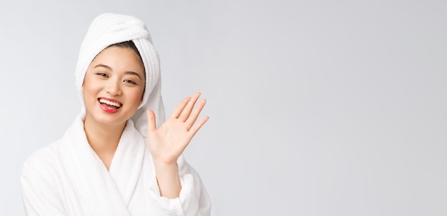 Spa skincare beauty Asian woman drying hair with towel on head after shower treatment Beautiful multiracial young girl touching soft skin