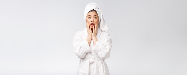 Spa skincare beauty Asian woman drying hair with towel on head after shower treatment Beautiful multiracial young girl touching soft skin