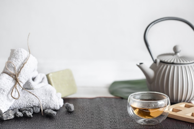 Spa still life with face and body skin care products and tea  background