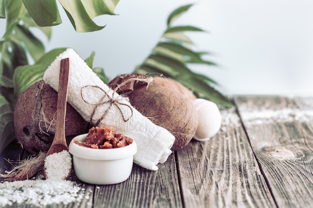 Spa and wellness setting with flowers and towels. Bright composition with tropical flowers. Dayspa nature products with coconut