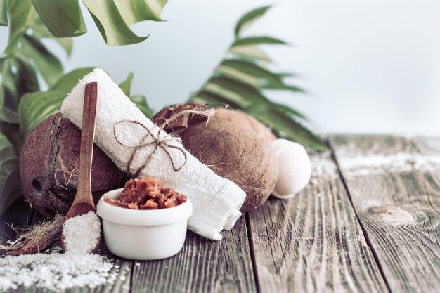 Spa and wellness setting with flowers and towels. Bright composition with tropical flowers. Dayspa nature products with coconut