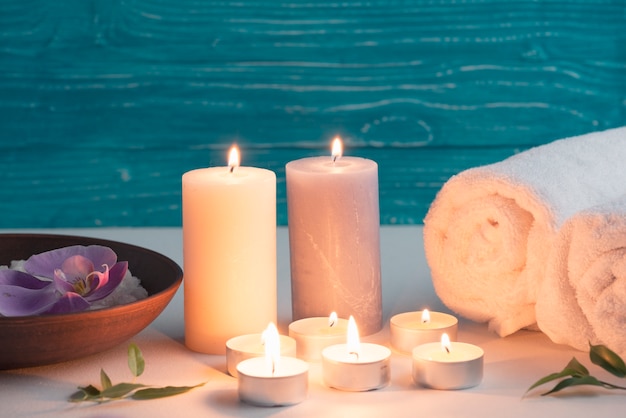 Spa wellness setting with sea salt and illuminated candles