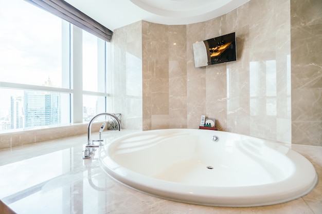 Spacious bathtub next to a window