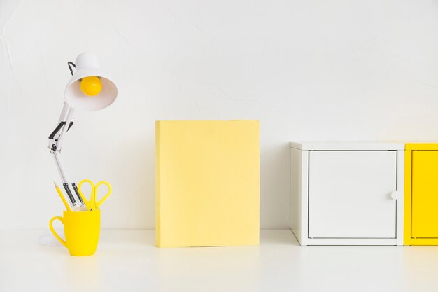 Spacious workplace with metal boxes and yellow notebook