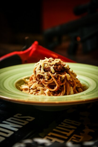 Spaghetti bolognese meat tomato parmesan side view