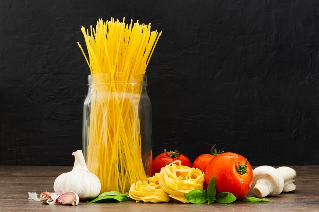 Spaghetti in jar with tomatoes and garlic