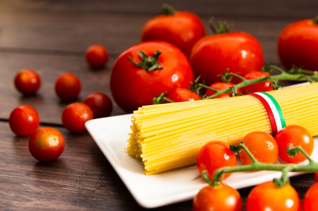 Spaghetti on plate with cherry tomatoes