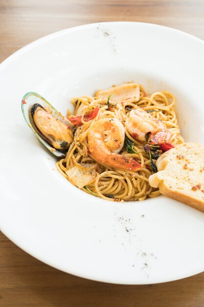 Spaghetti seafood in white plate