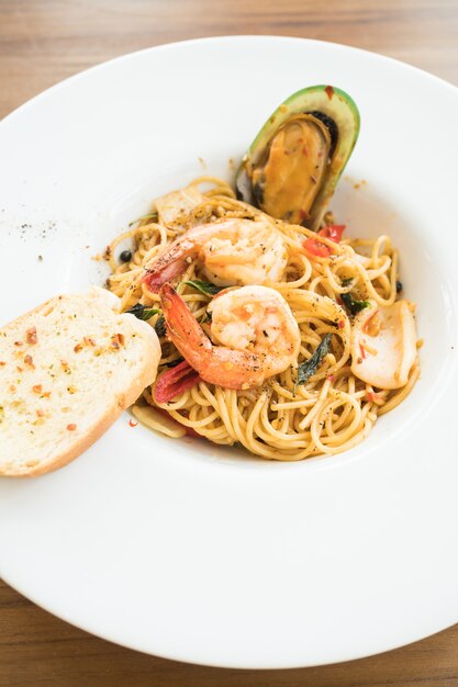 Spaghetti seafood in white plate