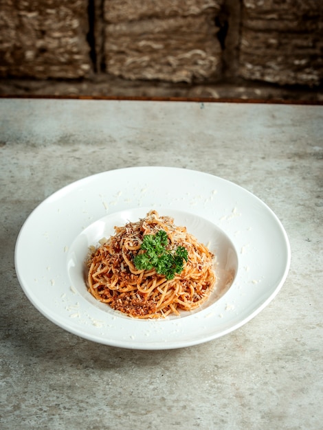 Spaghetti with chopped meat and herbs