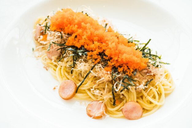 Spaghetti with sausage, shrimp egg, seaweed, dry squid on top