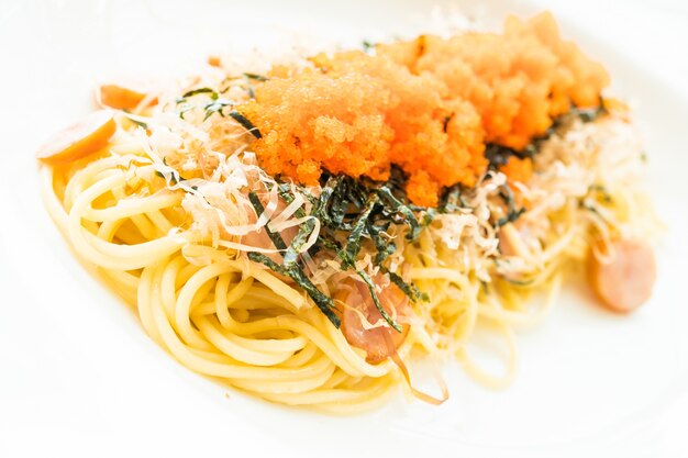 Spaghetti with sausage, shrimp egg, seaweed, dry squid on top