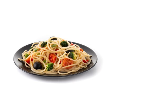 Spaghetti with vegetablesbroccolitomatoespeppers isolated on white background