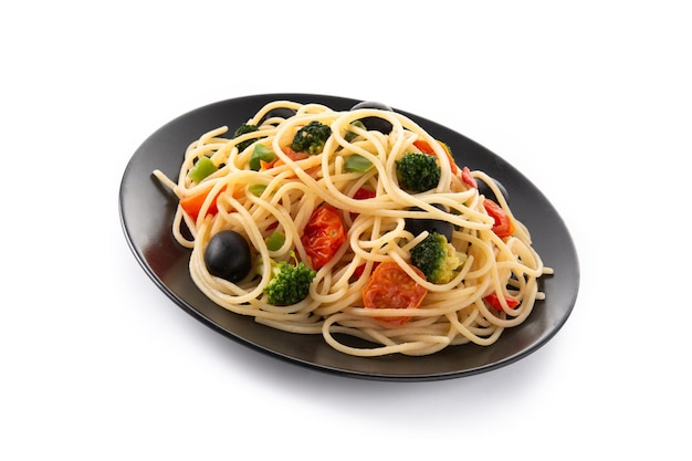 Spaghetti with vegetablesbroccolitomatoespeppers isolated on white background