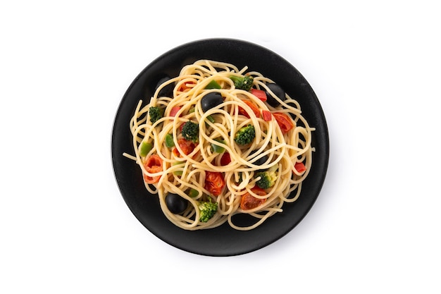 Spaghetti with vegetablesbroccolitomatoespeppers isolated on white background