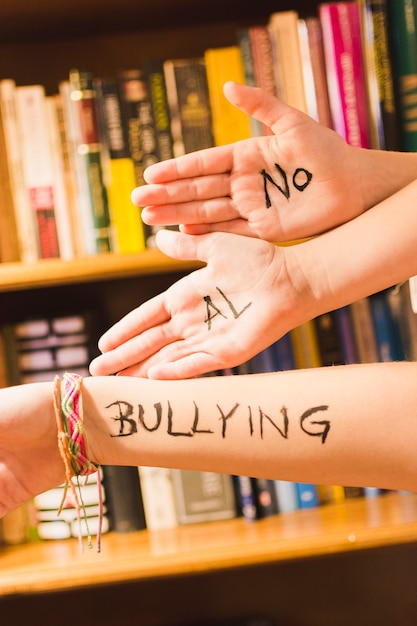 Spanish message against bullying on children's hands 