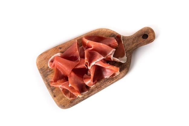 Spanish serrano ham on cutting board