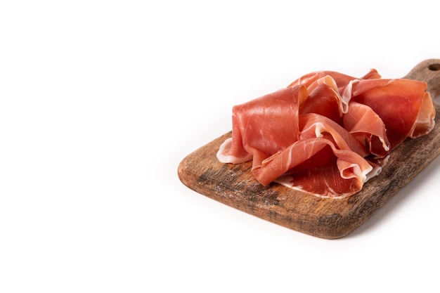 Spanish serrano ham with olives and breadstick isolated on white background