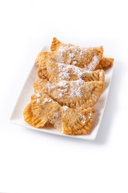 Spanish sweet stuffed pastry filled with angel hair isolated on white background