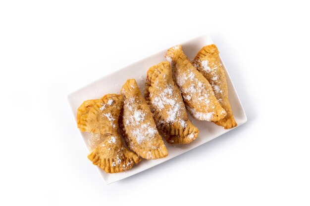 Spanish sweet stuffed pastry filled with angel hair isolated on white background