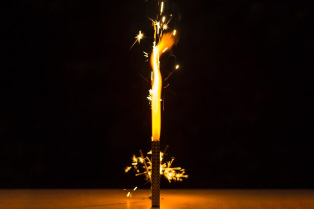 Sparkler on desk for the independence day celebration against black background