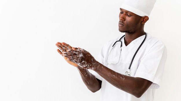 Specialist male doctor washing his hands