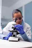 Free photo specialist pharmacist examining bacteriology infection lab test