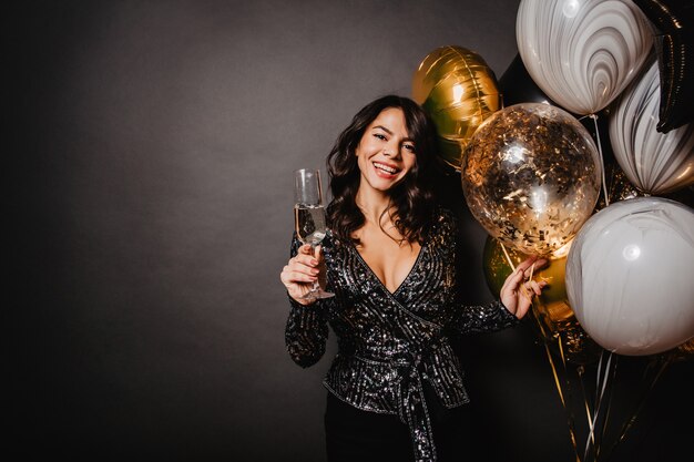 Spectacular woman enjoying champagne at event