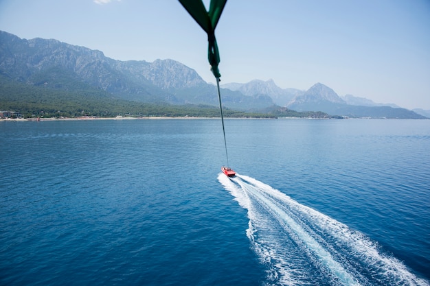 Free photo speedboat with parachute