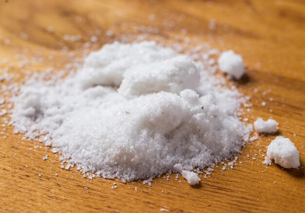 Spices. Heap of salt on the table