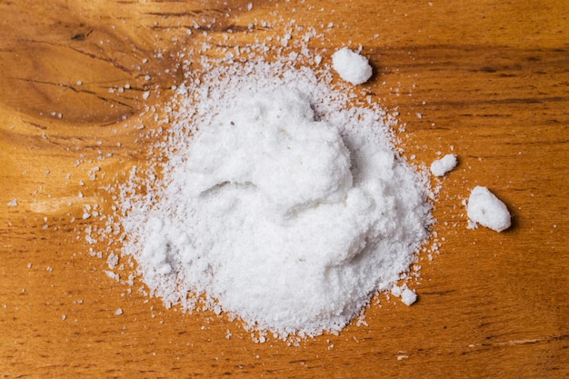 Spices. Heap of salt on the table