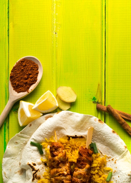 Free photo spices and lemon near lavash and chicken kebab