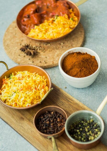 Spices and rice dishes on boards