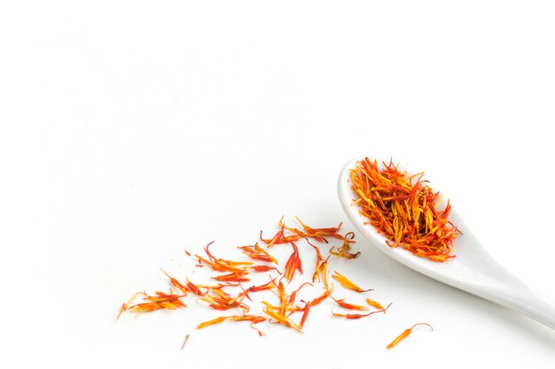 Spices on spoon and spread on table