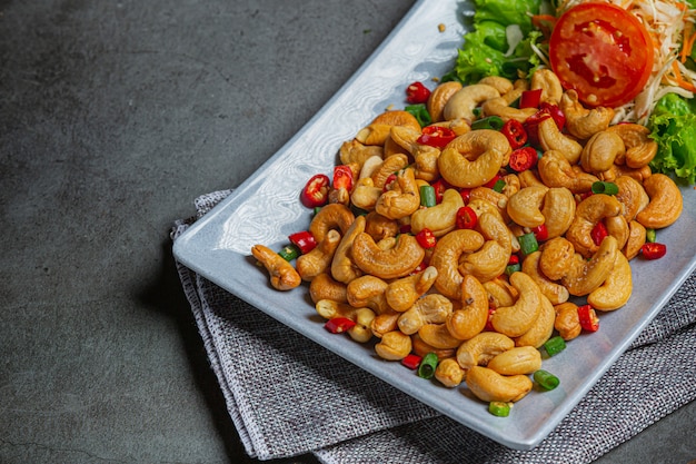 Spicy cashews topped with chopped hot chilli.