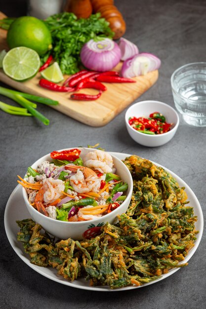 Spicy crispy morning glory salad with shrimp, spicy fresh shrimp, Thai food.