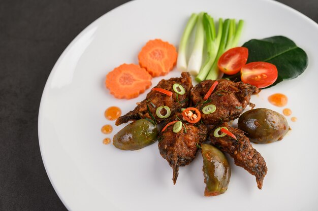 Spicy Fried Stir Catfish on white plate, Thai food.