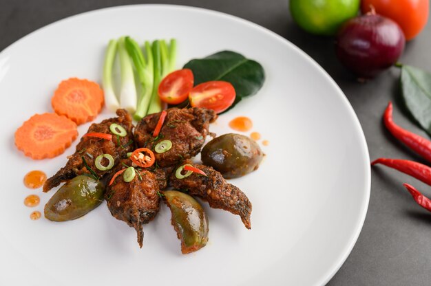 Spicy Fried Stir Catfish on white plate, Thai food.