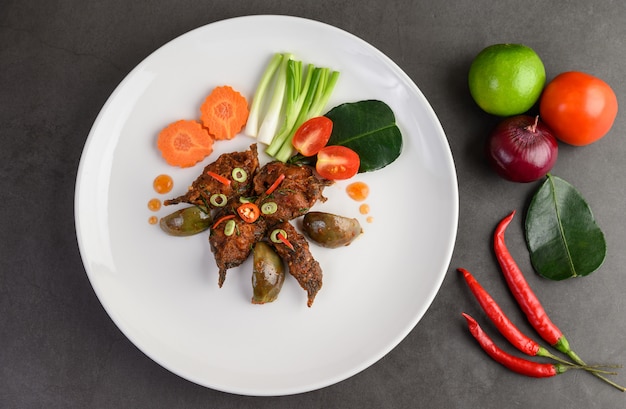 Spicy Fried Stir Catfish on white plate, Thai food.