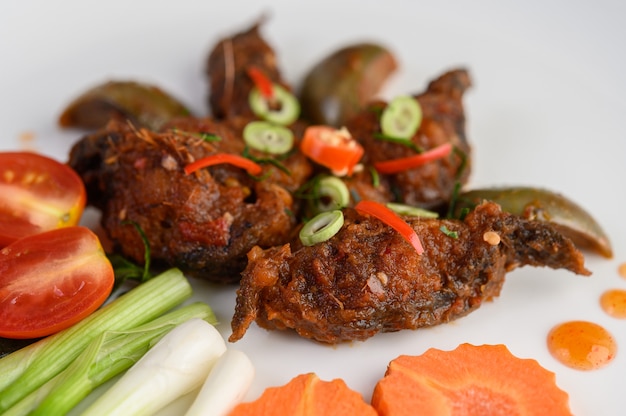 Spicy Fried Stir Catfish on white plate, Thai food.