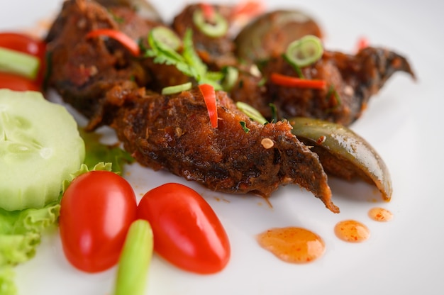 Spicy Fried Stir Catfish on white plate, Thai food.