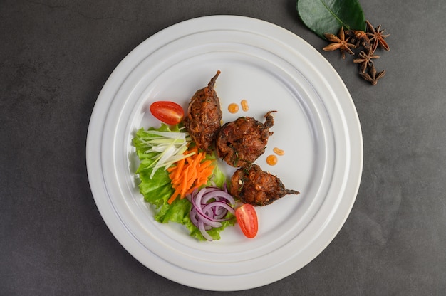 Spicy Fried Stir Catfish on white plate, Thai food.