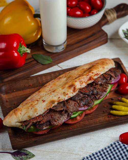 spicy meat in bread with vegetables